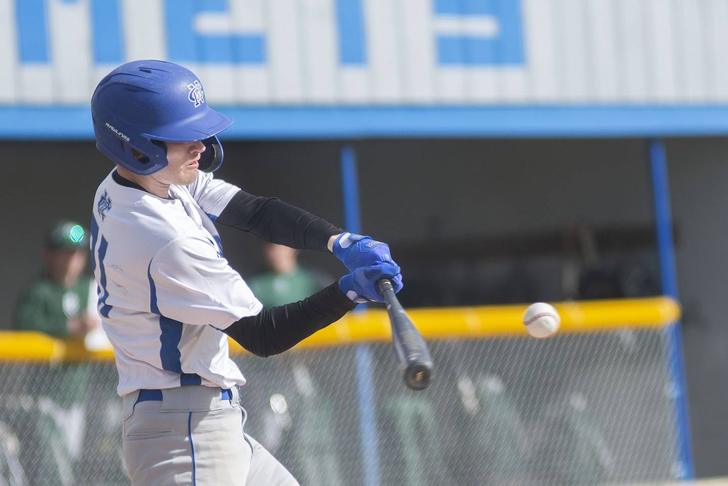 Newman's Nolan Britt drives a ball against St. Bede Thursday, April 14, 2022.