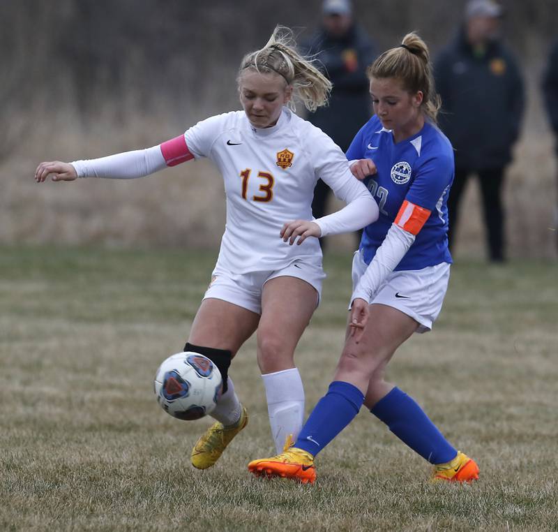 Richmond-Burton's Jordan Otto controls the ball in front of Woodstock's Reese Freund during a Kishwaukee River Conference soccer match Wednesday, April 30, 2022, between Richmond-Burton and Woodstock at Creekside Middle School.