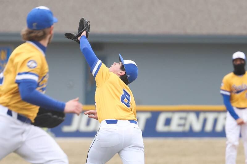 Joliet Central’s Robert Fitzpatrick attempts to catch the infield fly ball against Bolingbrook on Tuesday, March 21st. 2023.