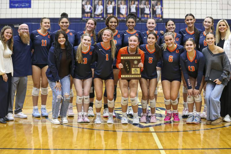 Oswego poses with the Class 4A Regional Final plaque after defeating Neuqua Valley. Oct 30, 2025 in Plainfield.