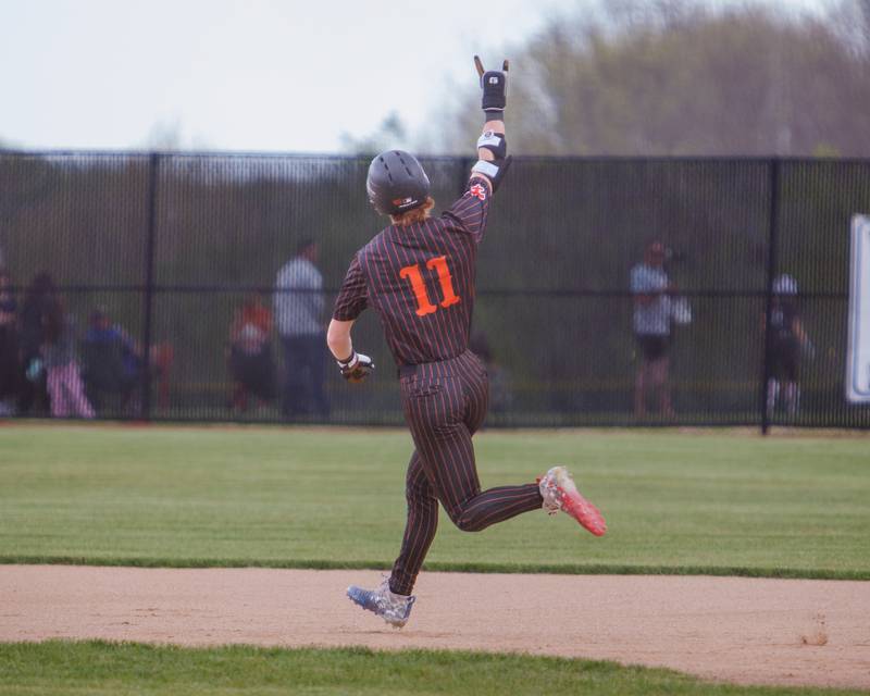 St. Charles East's Niko Vahmistrovs celebrates a homer against St. Charles North in the second inning on Monday May 4, 2026 in St. Charles.