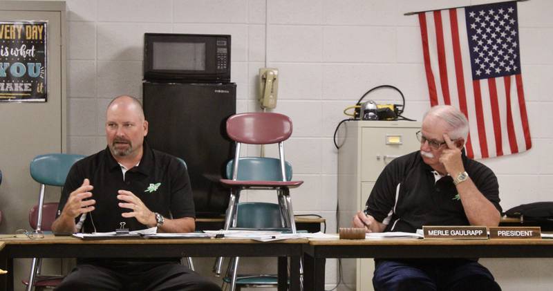 Ron McCord, superintendent, provides a rundown of the COVID-19 return-to-school plan on July 20 at Rock Falls High School. Merle Gaulrapp, board president, listens.