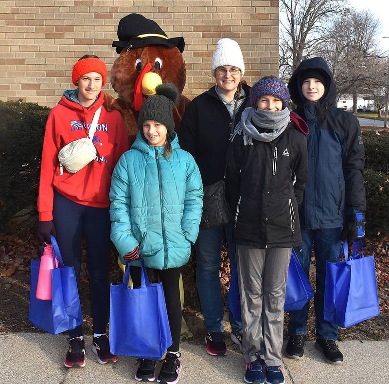 The chilly temperatures and the wind did not stop the Christin family from taking part in the fun at Morrison's Turkey Trot Saturday, Nov. 30, 2024.