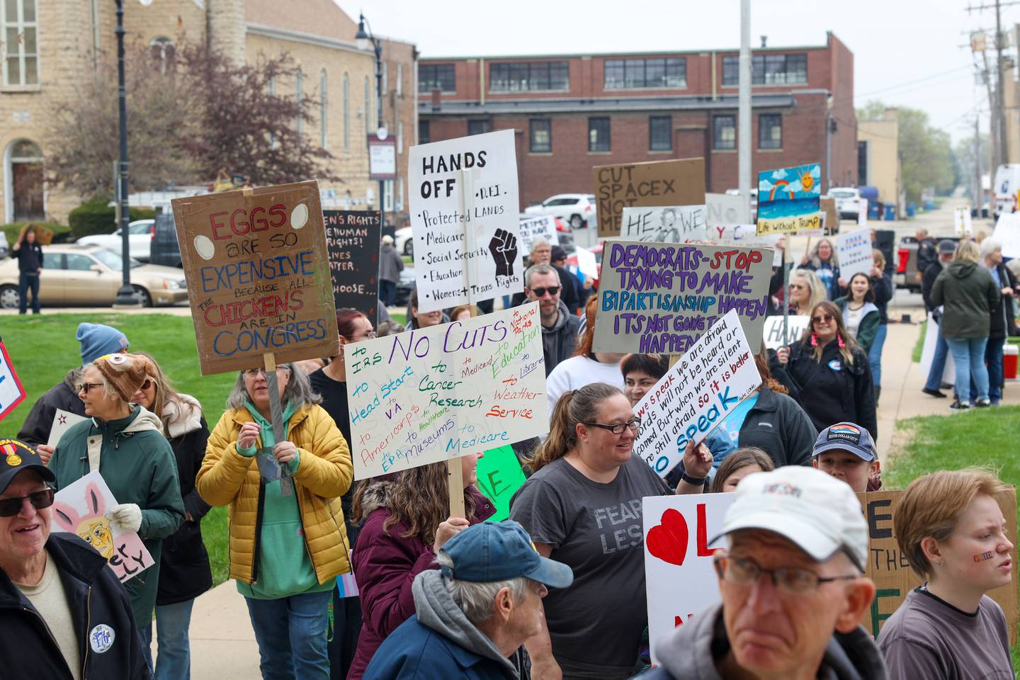 Over 250 protestors carry signs as they participate in rally chants during the Hands Off Rally at the Kankakee County Courthouse on Saturday, April 19, 2025.