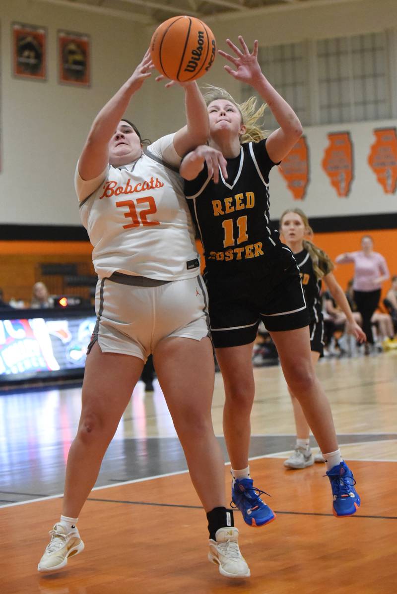 Beecher's Molly Vladika, left, and Reed-Custer's Morgan Toler battle for a rebound during a game at Beecher Tuesday, Jan. 20, 2026.