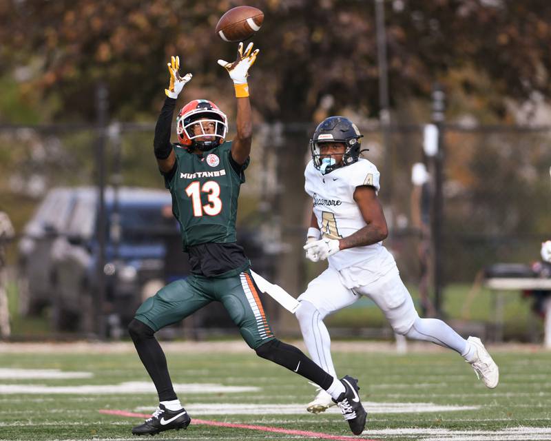 Morgan Park Chris Durr (13) cathes a pass during the second quarter on Saturday Nov. 4, 2023, while being defended by Sycamore Tyler Curtis (4) held at Gately Stadium in Chicago.