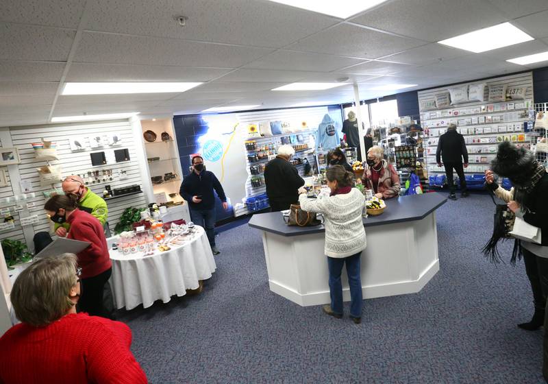 Tourists and locals browse through the gift shop at the new Heritage Corridor Visitors Center on Wednesday, Jan. 26, 2022 downtown Utica.