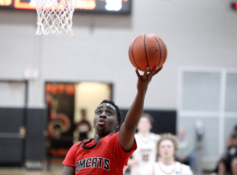 East Aurora’s Jalen Bealer puts the ball up during a game against St. Charles East in the 63rd Annual Ron Johnson Thanksgiving Tournament at St. Charles East on Monday, Nov. 21, 2022.