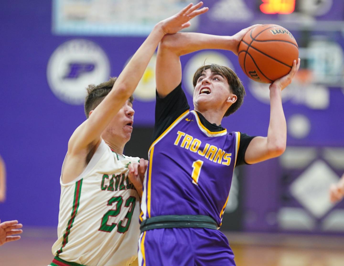 Mendota's Cale Strouss (1) shoots the ball in the post against LaSalle-Peru's Nicholas Olivero (23) during a first round game in the 60th annual Plano Christmas Basketball Tournament at Plano High School on Wednesday, Dec 27, 2023.