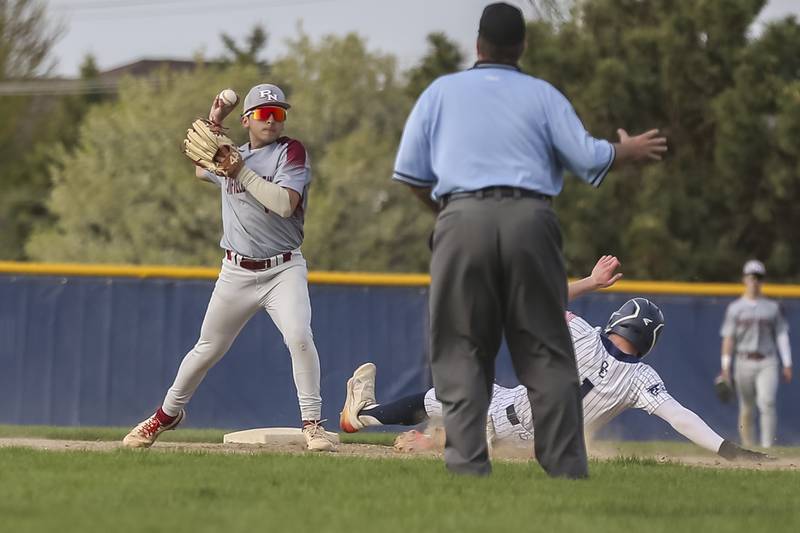 Plainfield North's Mateo Tristan (1) starts off a double play at second during baseball game between Plainfield North at Oswego East, Monday, April 28, 2025 in Oswego.