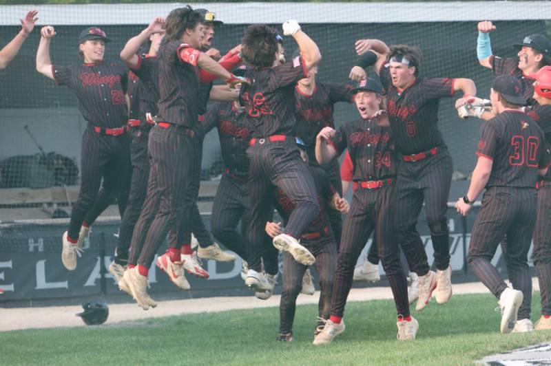 Benet's Merrick Sullivan celebrates with teammates after hitting a home run against Burlington Central at the Class 3A Kaneland Sectional Semi Final on Thursday, June 5, 2025 in Maple Park.
