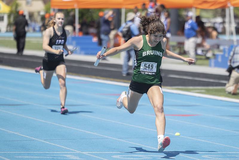 St. Bede’s Lily Bosnich crosses the finish line in the 4x200 race Saturday, May 20, 2023 during the IHSA state track and field finals at Eastern Illinois University in Charleston.
