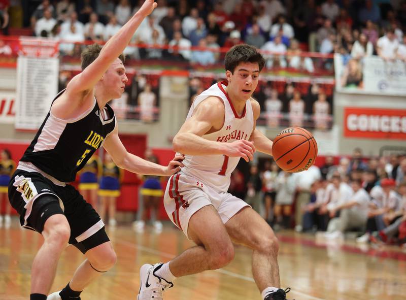 Hinsdale Central's Evan Phillips (1) dribbles the ball up court during the boys 4A varsity sectional semi-final game between Hinsdale Central and Lyons Township high schools in Hinsdale on Wednesday, March 1, 2023.