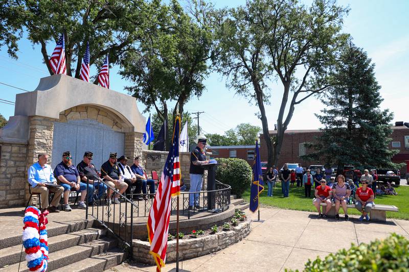 Bradley American Legion Commander Corey Norton reads a poem written by a veteran during the Legion's Memorial Day ceremony on Monday, May 25, 2026.