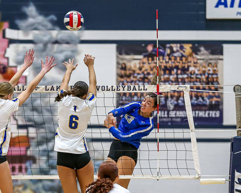 St. Charles North's Haley Burgdorf (23) spikes the ball during Class 4A Lake Park Regional final volleyball match between Wheaton North at St Charles North.  Oct 31, 2024  in Roselle.