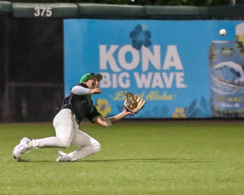 Providence Catholic's Samy Atkinson (2) makes a diving catch during a Class 4A supersectional baseball game between Providence and Brother Rice on Monday, June 9, 2025, in Crestwood.