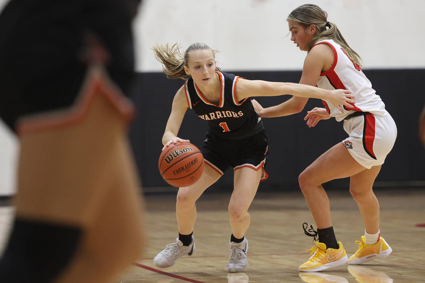 Lincoln-Way West’s Peyton drives around Lincoln-Way Central’s Gianna Amadio on Tuesday, Dec. 5, 2023 in New Lenox.