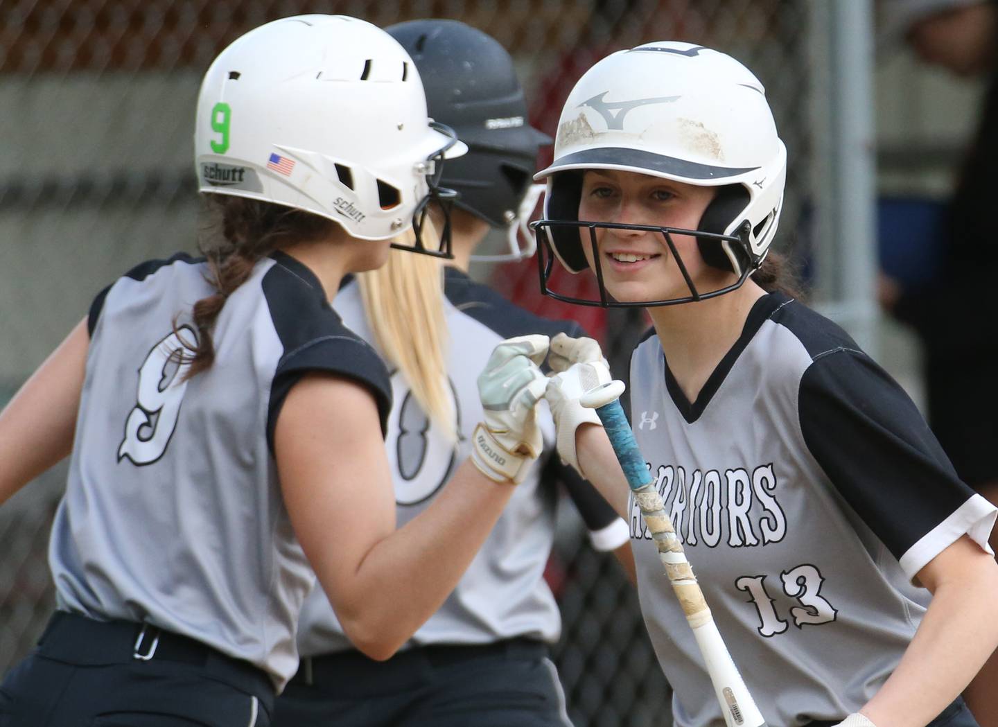WFC's Shae Simons (9) high-fives teammate Kaiden Connor (13) after Simons scored a third-inning run against Henry-Senachwine on Monday, May 8, 2023, in Henry.
