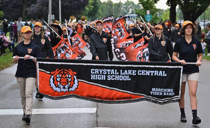Crystal Lake Central High School's Eileen Wei (Left) and Audrey Kanellopoulos lead the school's Marching Tiger Band to begin the start of the school's 100 year anniversary homecoming day parade on Saturday, Sep. 16, 2023 in Crystal Lake. The parade began at the high school and made its way through downtown Crystal Lake.