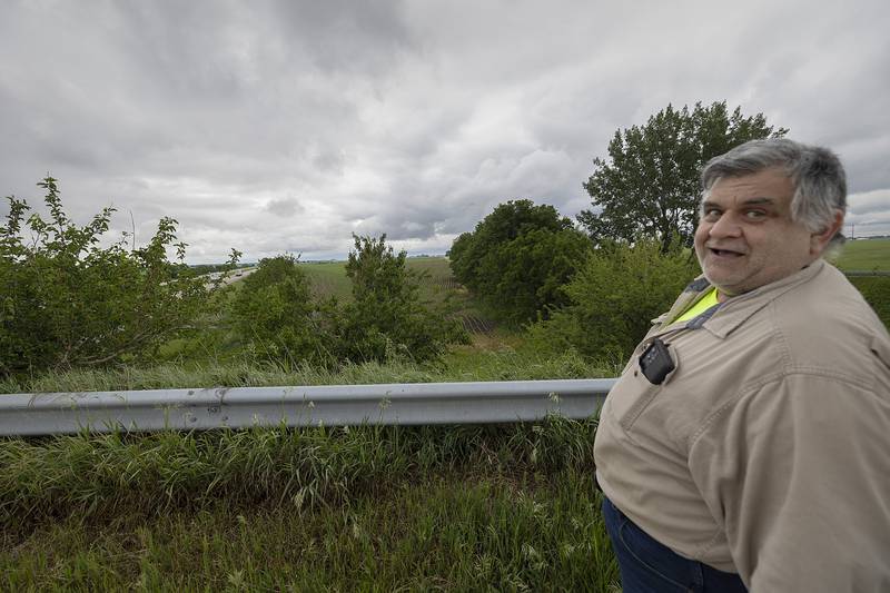 Dodge looks over the far side guard rail Wednesday, June 4, 2025. The trucker cleared the rail and landed in an empty field on the other side.