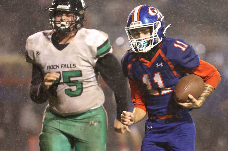 Genoa-Kingston's Dakota Dynek heads in for a touchdown with Rock Falls' Jacob Hosler on his heels during their game Friday, Oct. 13, 2023, at Genoa-Kingston High School.