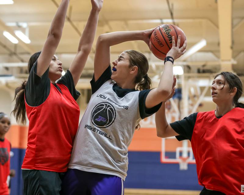 Plaon's Kyla Baier looks for an opening underneath the basket at the Oswego girls basketball shootout tournament. June 28, 2024.
