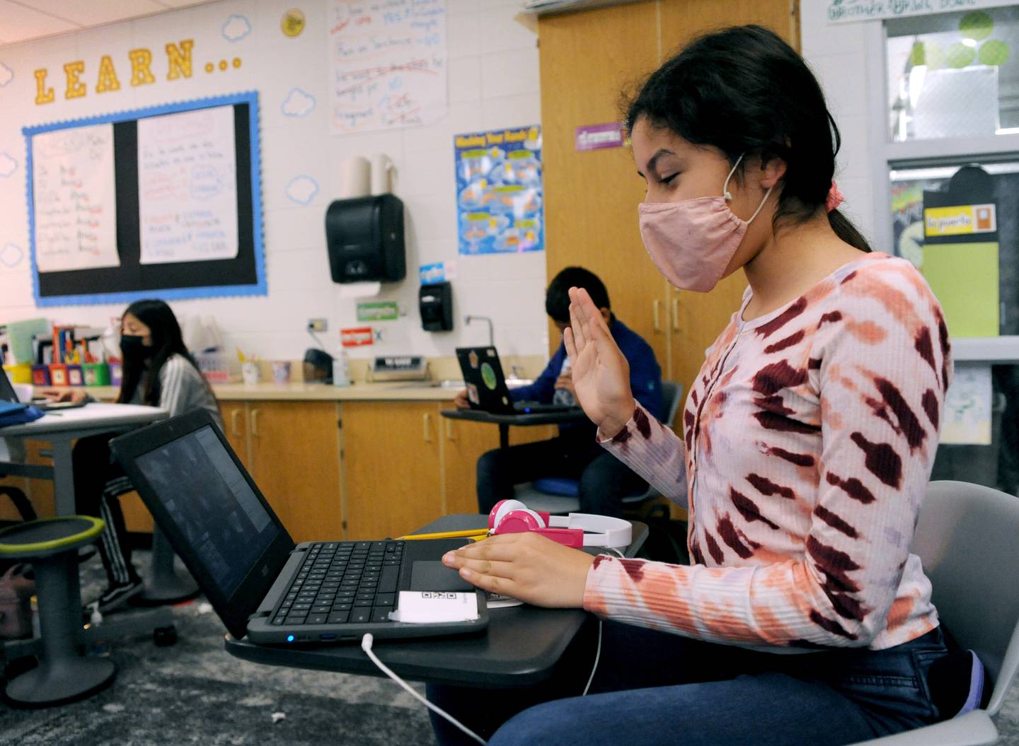 Sophia Muro, 10, converses with a with student from Spain Wednesday, May 18, 2022, during a fifth-grade dual language class at Coventry Elementary School in Crystal Lake. Teacher Victoria Garcia Blanco, a native of Spain, organized the exchange to connect the students with students from Colegio Sagrado Corazón de Jesús Vedruna, the school in Spain where she previously taught.