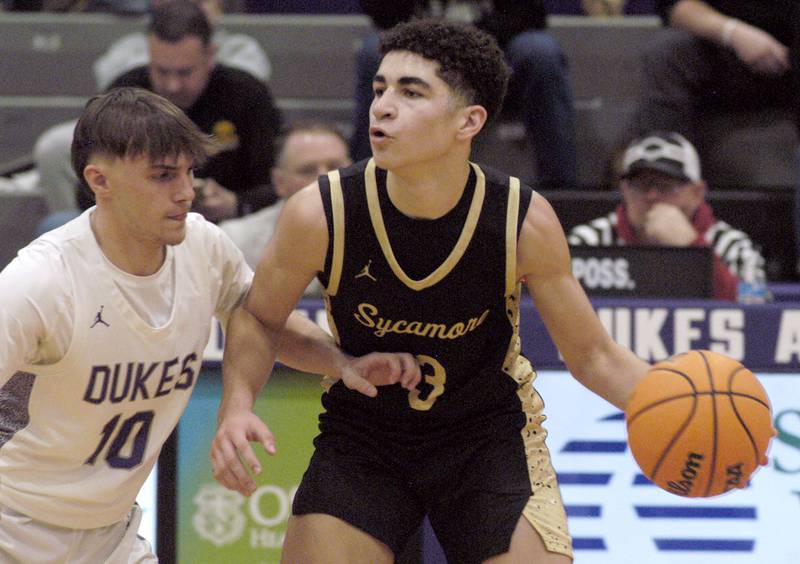 Sycamore's Marcus Johnson brings the ball up court against Dixon's Brady Feit. The Dixon Dukes hosted  the Sycamore Spartans in a non-conference game  on Friday, December 19th, 2025.