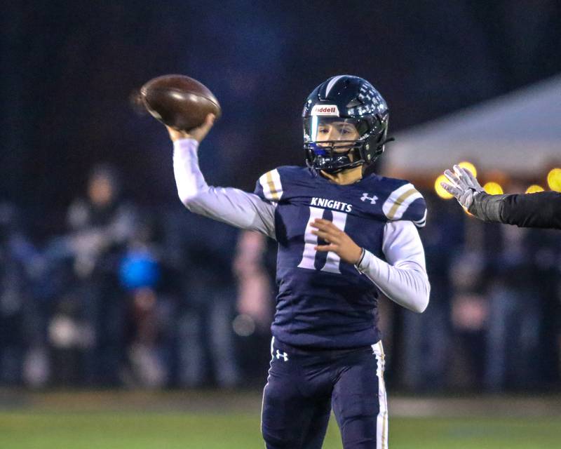 IC Catholic Prep's Dennis Mandala (11) passes during Class 4A third round playoff football game between St Laurence at IC Catholic Prep.  Nov 11, 2023.