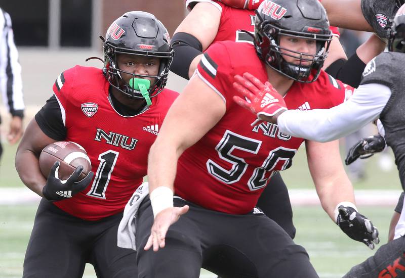 Northern Illinois running back Antario Brown follows the blocking of offensive lineman Pete Nygra during the Spring Showcase Saturday, April 22, 2023, at Huskie Stadium at NIU in DeKalb.