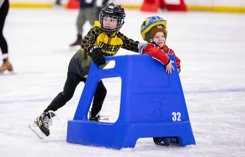 Will Loser, 6, pushes his brother Luke Loser around during open skate at Crystal Ice House in Crystal Lake on Friday, Jan. 3, 2025.