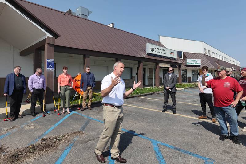 DeKalb Mayor Cohen Barnes speaks during a special meeting of the DeKalb City Council Monday, May 9, 2022, in the parking lot of the former Hillcrest Shopping Center. The meeting was held to kick off the demolition process of the strip mall on Hillcrest Drive which will begin Tuesday morning.