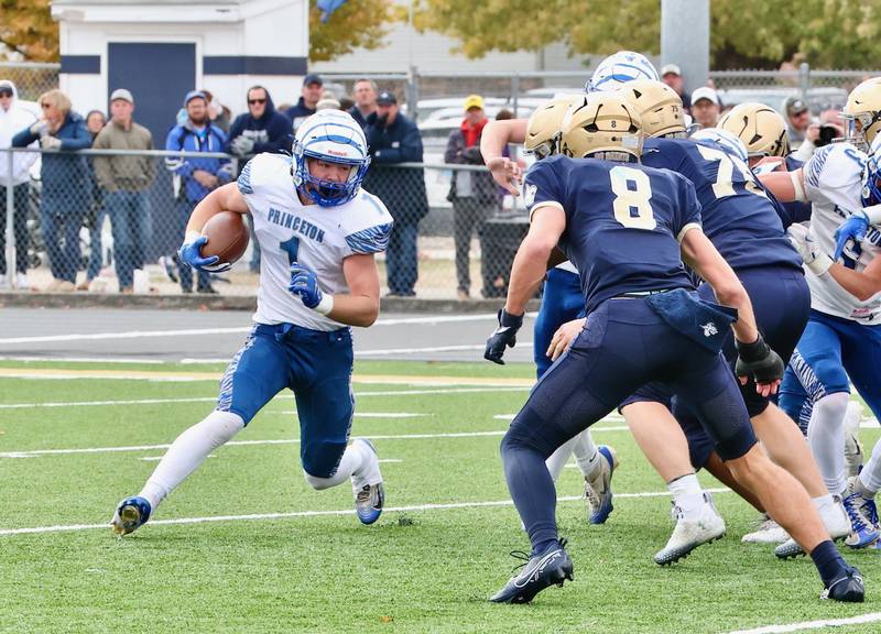 Princeton's Casey Etheridge runs against Bloomington Central Catholic in Saturday's 3A playoff opener in Bloomington. He rushed for 146 yards and finishes his career ranked No. 18 all-time in the IHSA with 5,345 yards.