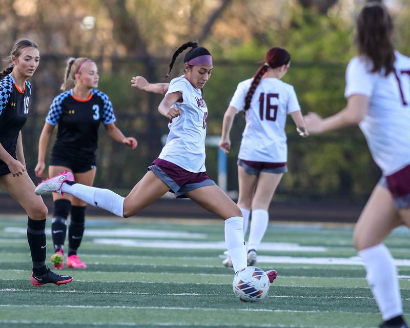 Morton's Stephanie Salmeron (7) kicks the ball down the pitch during soccer match between Morton at Willowbrook.  April 15, 2024.