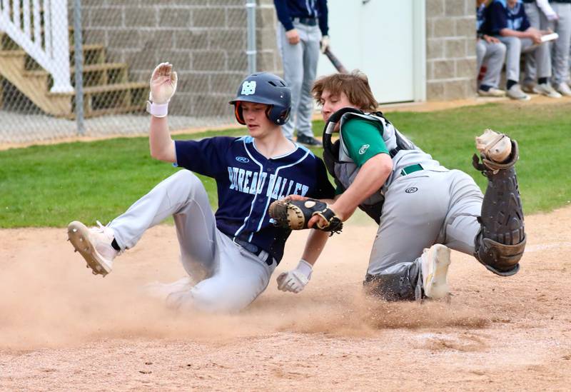 Bureau Valley's Brock Foster scores the game-tying run in the seventh inning on a sac fly by Sam Rouse. Foster had a key two-run triple.