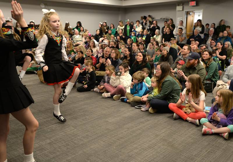 Trinity Irish Dancers including Penny Blazek entertain a full capacity room at the Downers Grove Library Saturday, March 16, 2024.