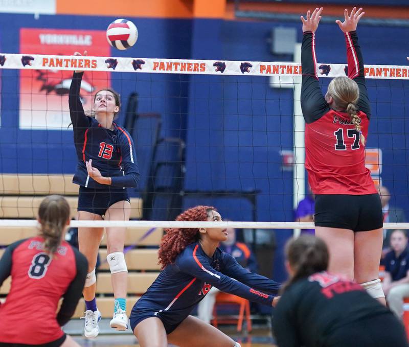 Oswego’s Sidney Hamaker (13) goes up for a kill against Yorkville during a volleyball match at Oswego High School on Thursday, Sept. 14, 2023.