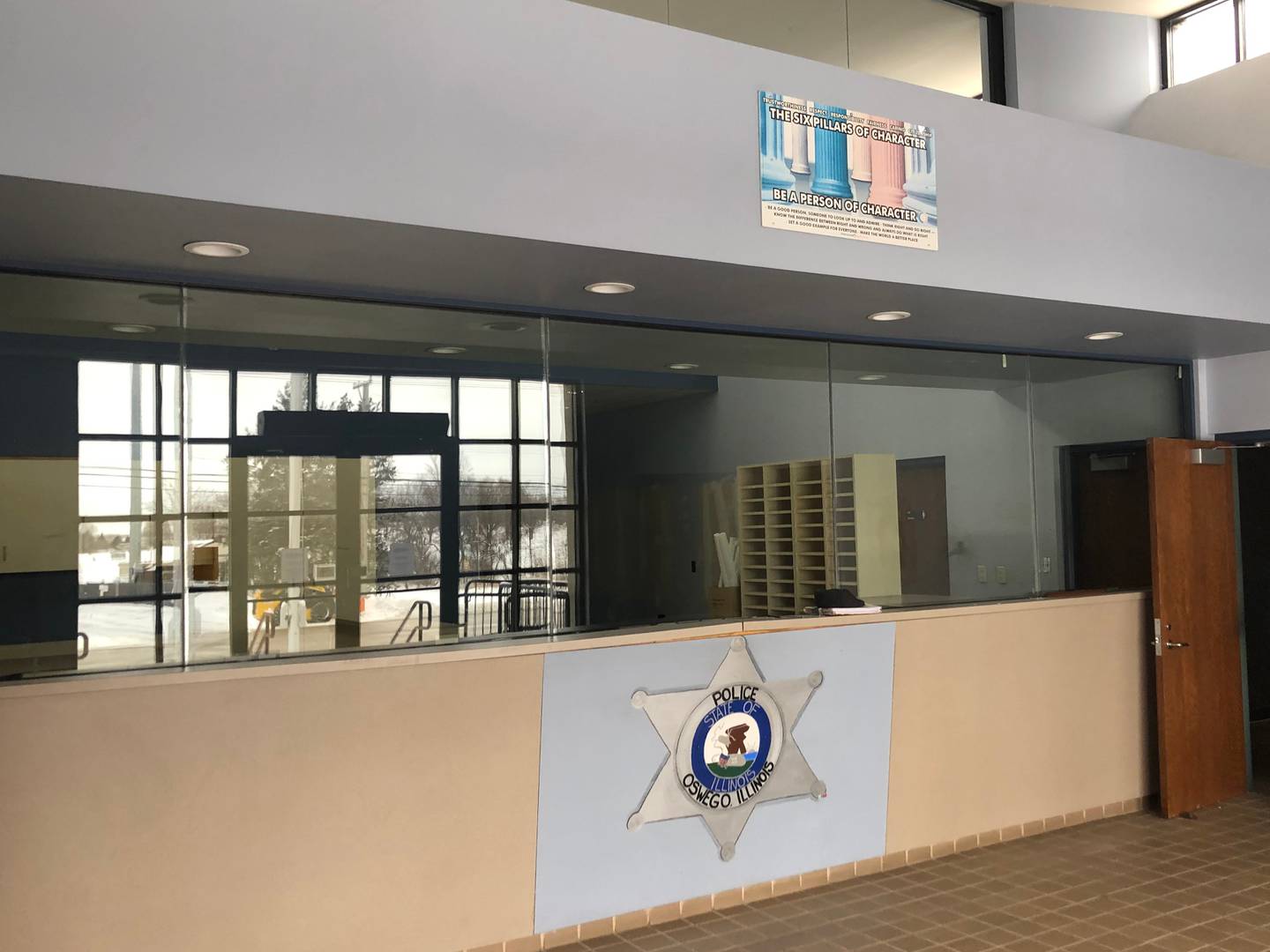 Entrance/lobby view of front desk still in police department state