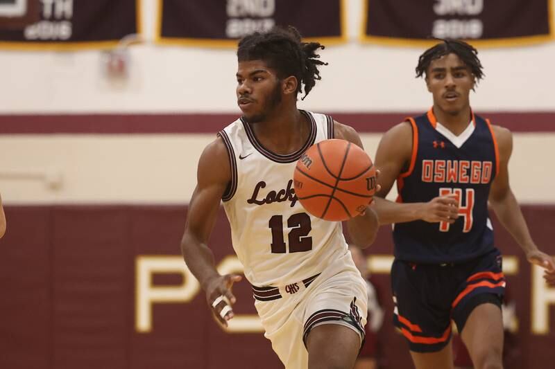 Lockport’s Jalen Falcon looks to make a play against Oswego.