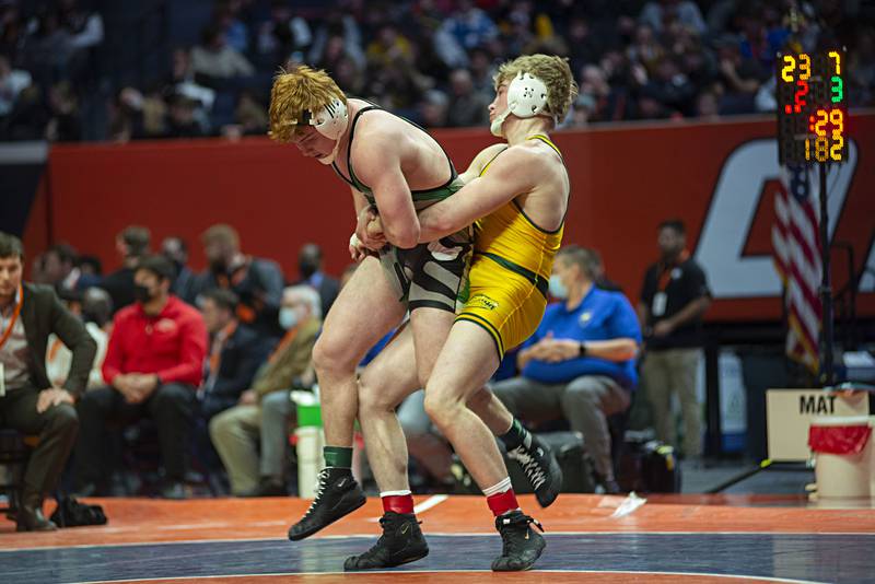Shane Moran of Crystal Lake South lifts Grays Lake Central's Matty Jens during the 2A 182lb finals match at the IHSA state wrestling meet on Saturday, Feb. 19, 2022.