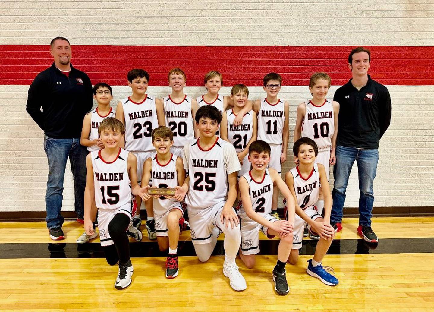 The Malden Musketeers won their first BVEC championship, upending 8-time champion DePue 35-31. Team members are (front row, from left) Titan Foster, Matthew Bohms, Joseph Perez, John Lower and Nikolai Pierson; and (back row) coach Nick Lower, Joel Salazar, Jase Perez, Aidan Rossler, Spartan Foster, Dexter Bankes, Max Morse, Daniel Reynolds and coach Jacob Burns.