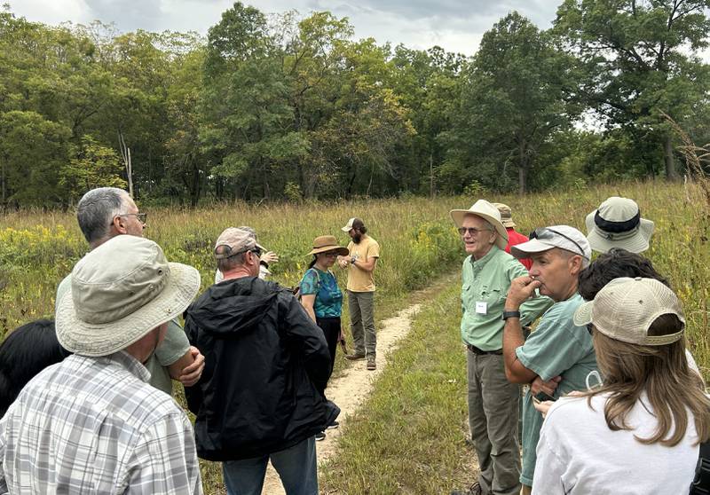 Bernie Buchholz of the Friends of Nachusa Grasslands speaks to participants of the "Prairie Meets Savanna" guided nature hike at the Nachusa Grasslands on Saturday, Sept. 20, 2025 during Autumn on Prairie.