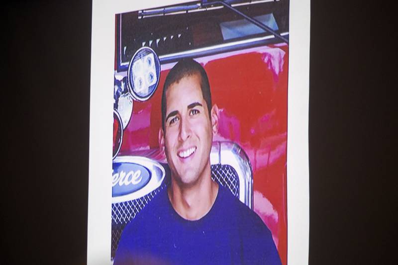 A picture of Garrett Ramos is shown on screen Friday, Nov. 14, 2025, during closing statements at his wrongful death trial in Morrison.