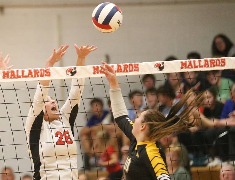 Putnam County's Myah Richardson pushes the ball ove the net away from Henry-Senachwine's Broolynn Thompson on Thursday, Aug. 28, 2025 at Henry-Senachwine High School.
