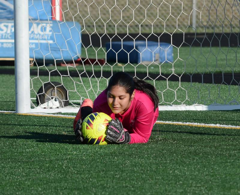 Oregon keeper Mili Zavala falls on a shot at the goal on Monday, March 31, 2025 during a game against Freeport at Freeport High School.