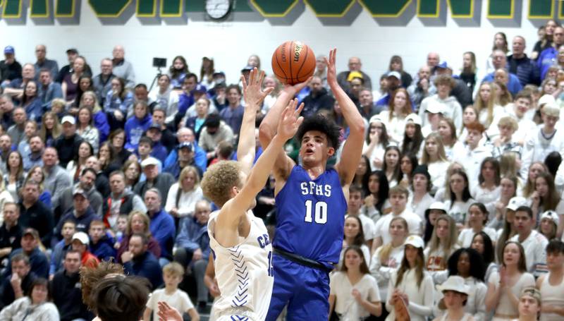 St. Francis’  Sebastian Miller takes a shot as Burlington Central’s Nick Carpenter defends during IHSA Class 3A Sectional final action Friday night at Crystal Lake South High School.