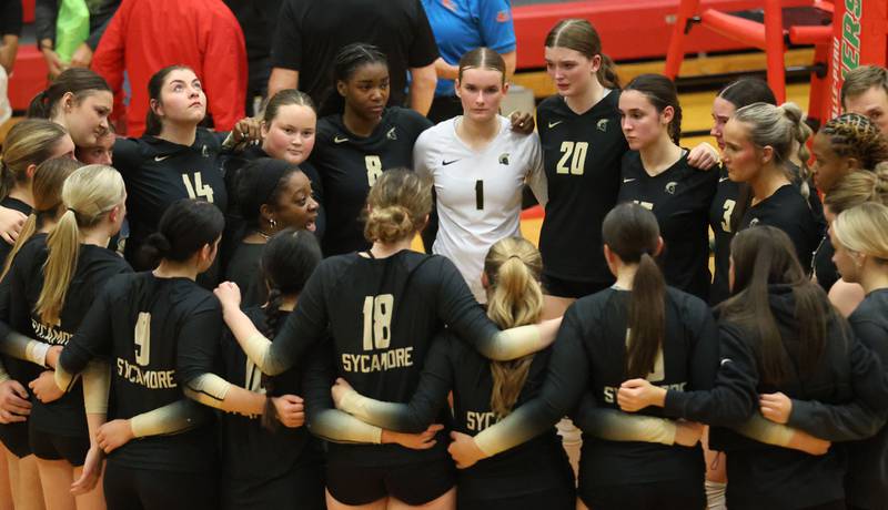 Members of the Sycamore volleyball team meet with head coach Jennifer Charles after loosing to Washington during the Class 3A Sectional semifinal game on Tuesday, Nov. 4, 2025 in Sellett Gymnasium at L-P High School.