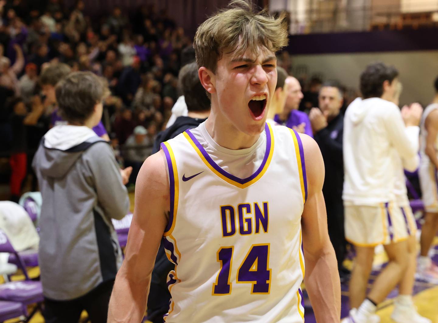 DGN's Maxwell Haack (14) reacts to winning the boys 4A varsity regional final between Downers Grove North and Proviso East in Downers Groves on Friday, Feb. 24, 2023.