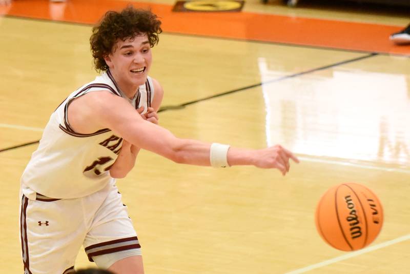 Kankakee's Eli Stipp makes a pass during the Kays' IHSA Class 3A Washington Sectional semifinal against Metamora.