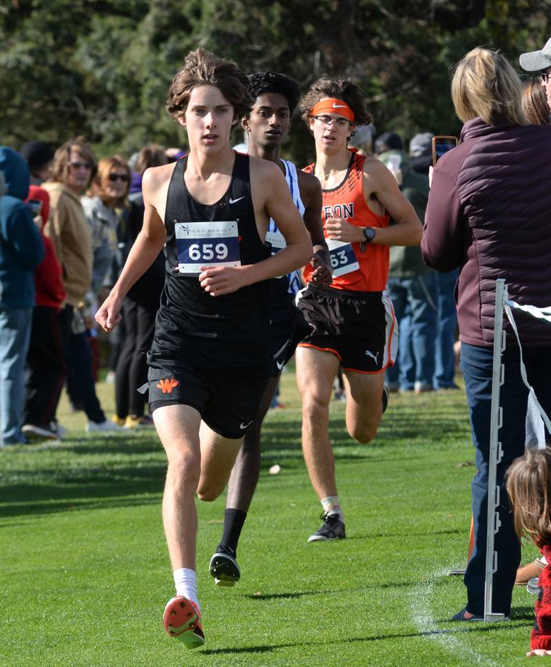 Winnebago's Nicolai Martino leads Rockford Christian's Andrew Kurien and Byron's Tim Starwalt at the 1A Rock Island Cross Country Sectional on Saturday, Nov. 2, 2024 at Saukie Golf Course in Rock Island.